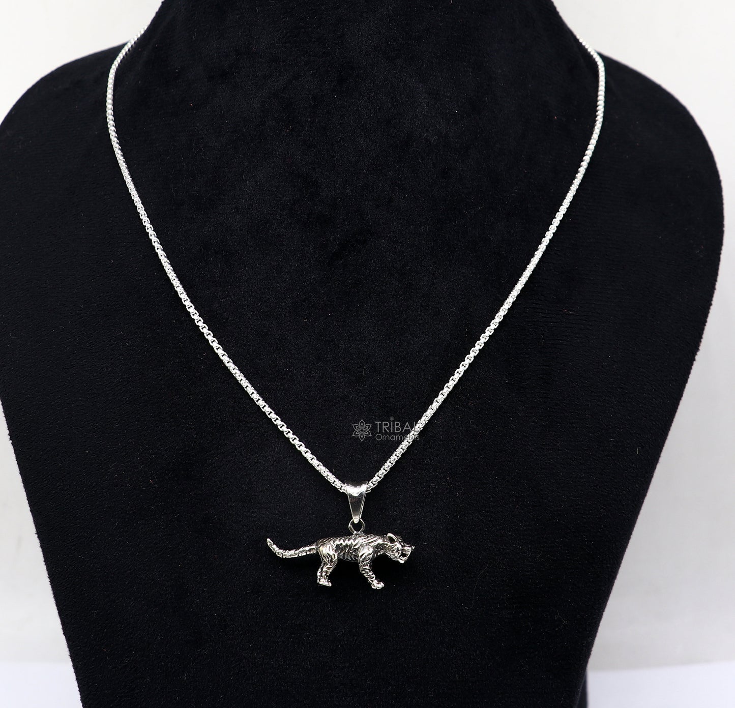 Sterling silver tiger/lion design pendant necklace by TRIBAL ORNAMENTS, unisex cultural jewelry with intricate animal motif.