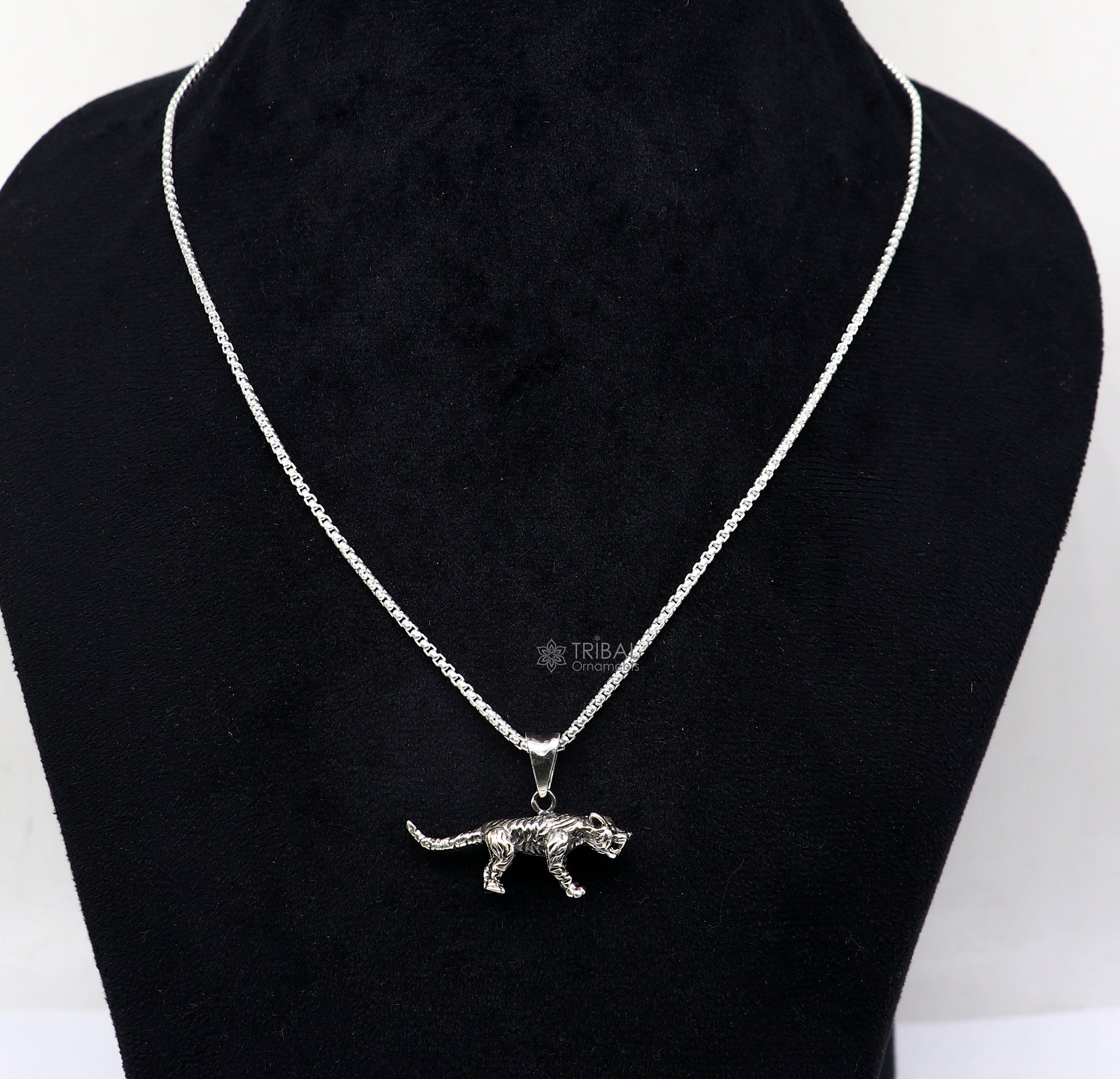 Sterling silver tiger/lion design pendant necklace by TRIBAL ORNAMENTS, unisex cultural jewelry with intricate animal motif.