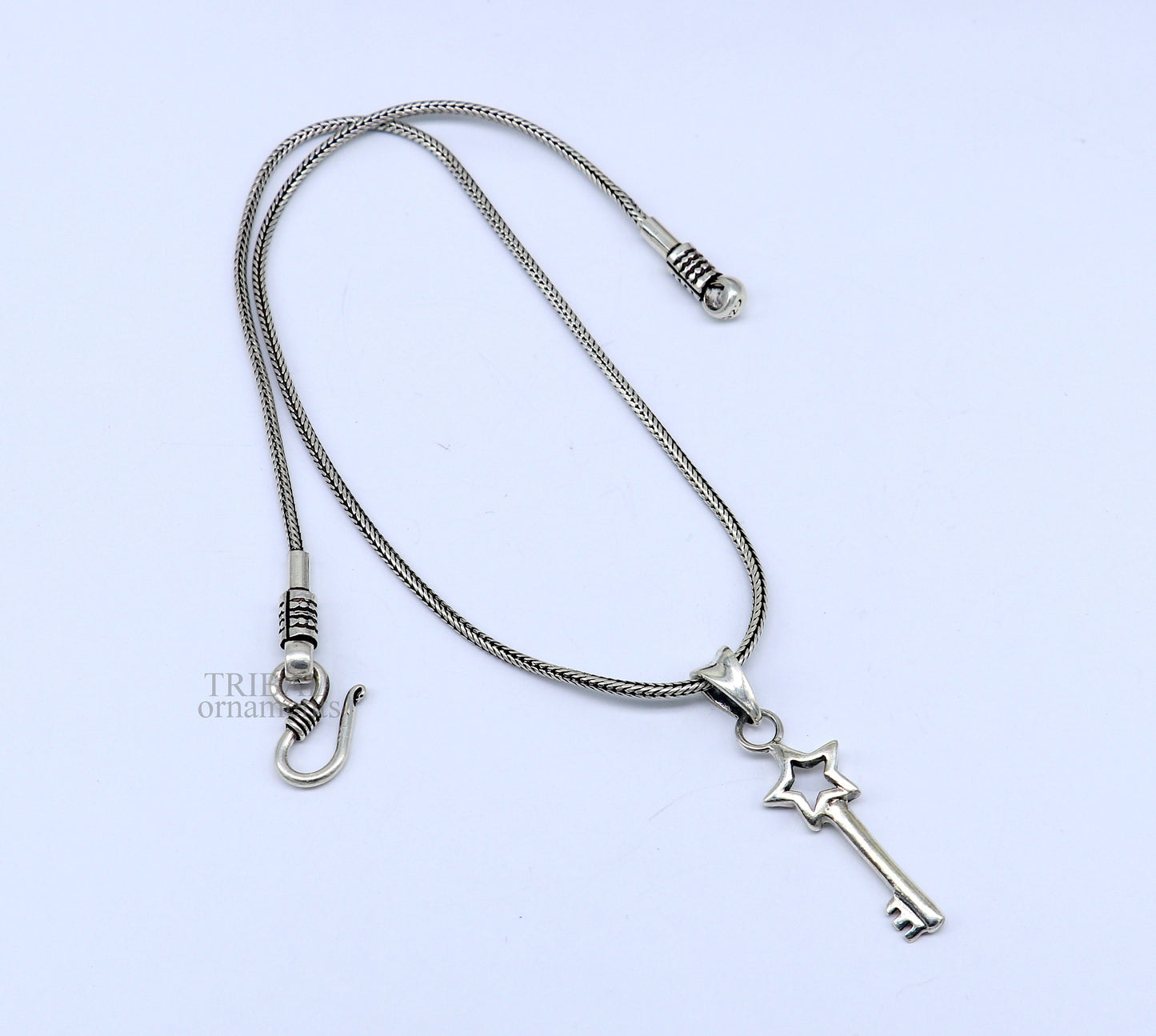 Sterling silver key and lock pendant by Tribal Ornaments, vintage-style handmade jewelry for boys and girls, stylish and attractive.
