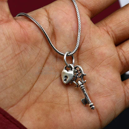 Sterling silver vintage style key and lock pendant by Tribal Ornaments, handmade jewelry for boys and girls.