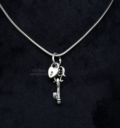 Sterling silver vintage-style key and lock pendant by Tribal Ornaments, handcrafted jewelry for boys and girls.