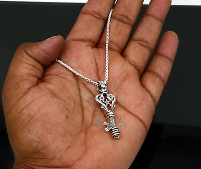 Sterling silver key pendant by TRIBAL ORNAMENTS, vintage-style handmade jewelry for boys and girls with intricate design.