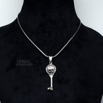Sterling silver vintage-style key pendant by TRIBAL ORNAMENTS, featuring intricate handmade design for boys and girls.
