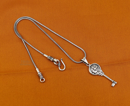 Sterling silver vintage key pendant by TRIBAL ORNAMENTS, handmade, stylish accessory for boys and girls.