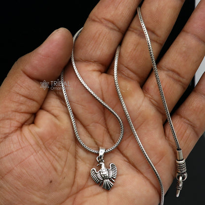 925 sterling silver bird pendant by TRIBAL ORNAMENTS, handmade dove symbol of peace, love, and purity, small and detailed.