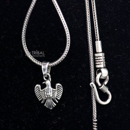 Sterling silver bird pendant by TRIBAL ORNAMENTS featuring a dove design symbolizing peace, love, and purity.