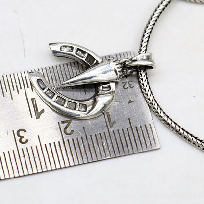 Sterling silver horseshoe pendant by Tribal Ornaments, handmade charm for boys and girls, small silver jewelry piece.