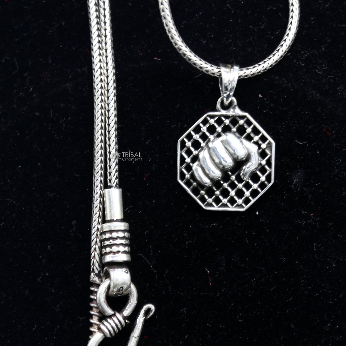 Sterling silver wrist punch pendant with tribal design, handmade jewelry for gym boys and girls, high-quality silver accessory.