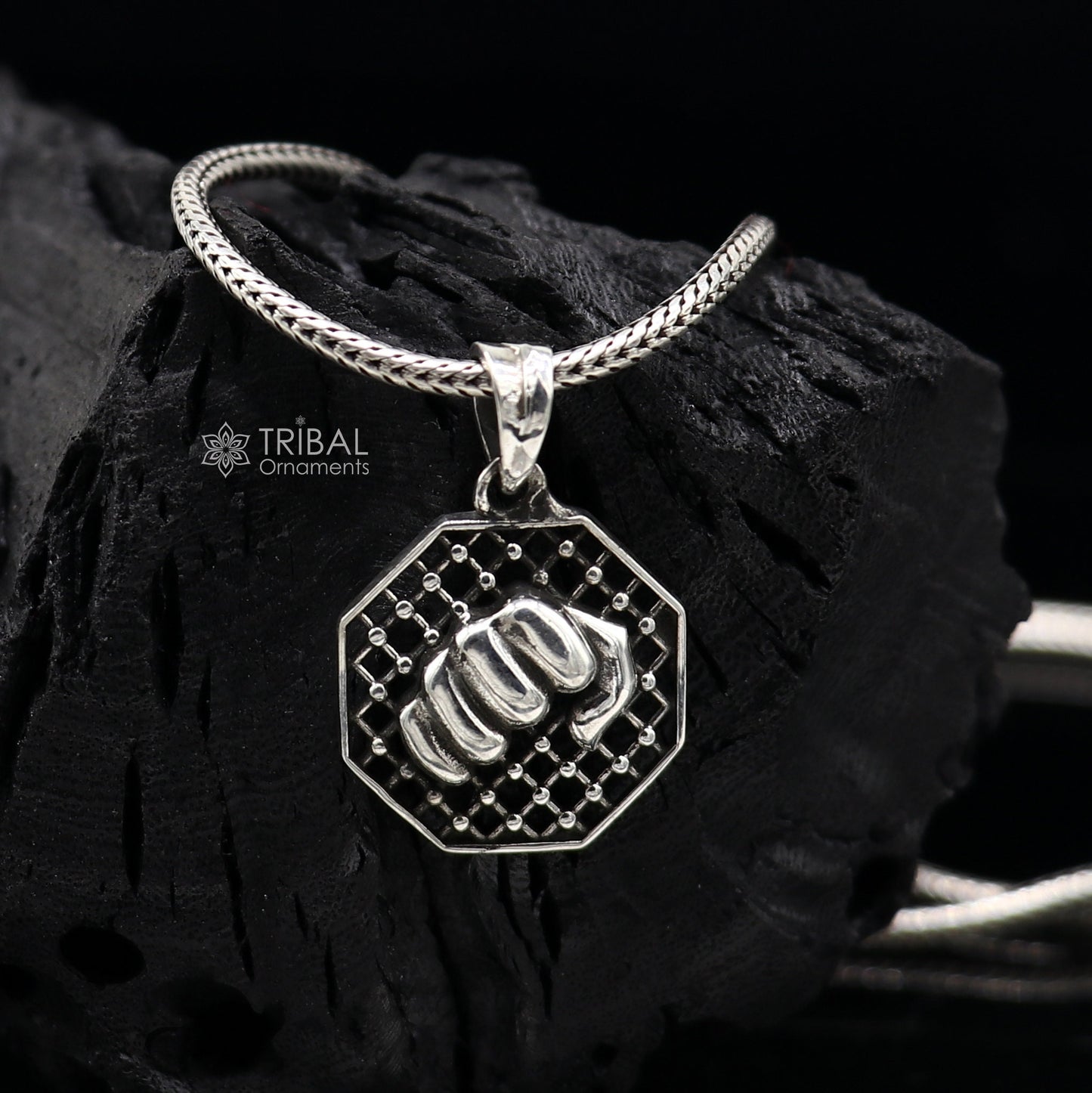 925 sterling silver wrist punch pendant featuring intricate handmade tribal design for boys and girls, ideal for gym or ZYM wear.