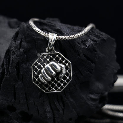 925 sterling silver wrist punch design pendant by Tribal Ornaments, featuring handmade, small pendant for gym boys and girls.