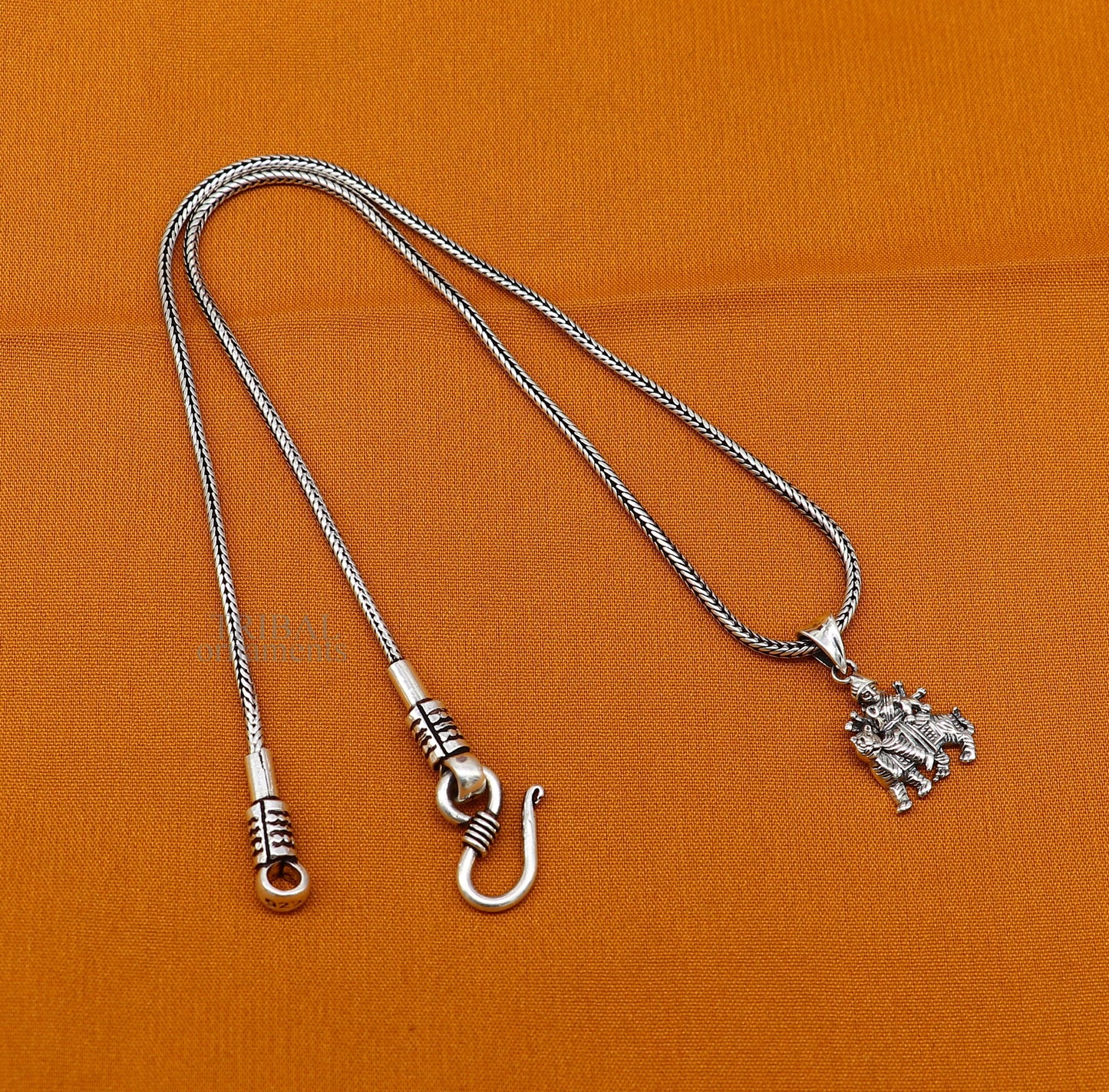 Unisex tribal pendant featuring divine Goddess Bhawani Durga Mataji in 925 sterling silver, intricate tribal jewelry design.