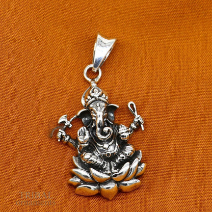 Sterling silver Ganesha pendant by Tribal Ornaments, unisex handmade jewelry with intricate divine design and personalized touch.