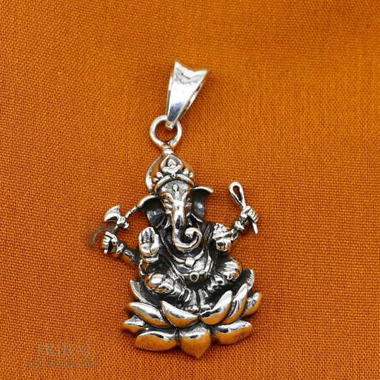 Sterling silver Ganesha pendant by Tribal Ornaments, unisex handmade jewelry with intricate divine design and personalized touch.