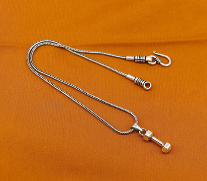 Sterling silver dumbbell pendant by TRIBAL ORNAMENTS, stylish unisex jewelry from India featuring a unique barbell design.