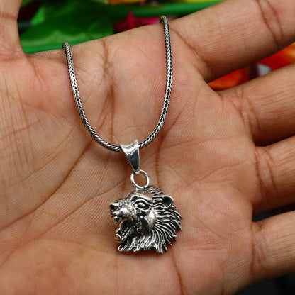 Sterling silver lion face pendant by TRIBAL ORNAMENTS, unisex handcrafted jewelry with intricate lion design, ideal for gifting.