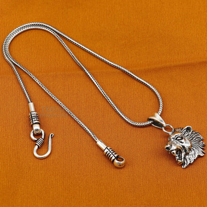 Elegant 925 sterling silver lion face pendant from TRIBAL ORNAMENTS, showcasing intricate handmade design for unisex jewelry gifting.