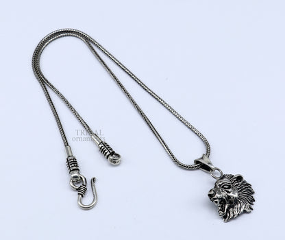 Sterling silver lion face pendant by Tribal Ornaments, unisex handmade jewelry with intricate tribal design.