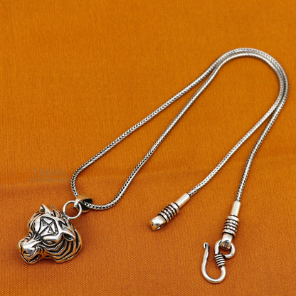 Sterling silver tiger face pendant by Tribal Ornaments, handmade unisex jewelry with intricate tribal design, perfect for gifting.