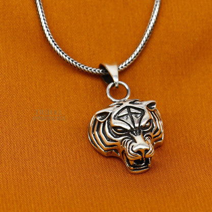 Unisex 925 sterling silver tiger face pendant by TRIBAL ORNAMENTS, handmade jewelry with intricate design, perfect for gifting.