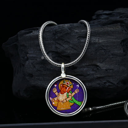 Sterling silver handmade Ganesha pendant with intricate painting, unisex jewelry, from TRIBAL ORNAMENTS, ideal for gifting.