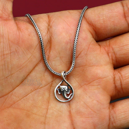 Sterling silver Lord Ganesha pendant from TRIBAL ORNAMENTS, handmade unisex jewelry with intricate divine design.
