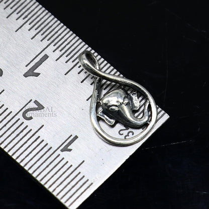 Sterling silver Lord Ganesha pendant by Tribal Ornaments, handmade unisex jewelry with intricate divine design.