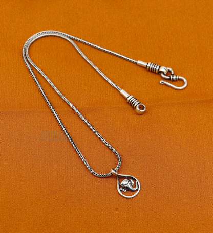 925 sterling silver Lord Ganesha pendant from TRIBAL ORNAMENTS, handmade unisex jewelry with intricate divine design.