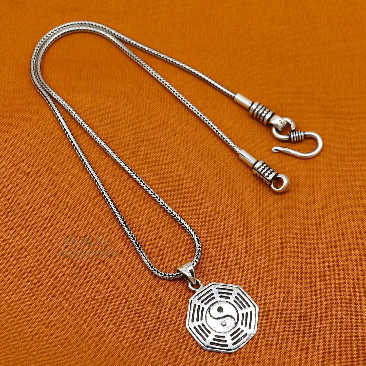Sterling silver unisex pendant with a round tribal design, personalized jewelry gift from TRIBAL ORNAMENTS.