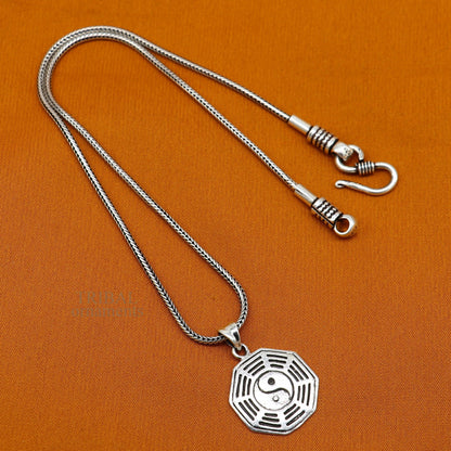 Sterling silver unisex pendant with a round tribal design, personalized jewelry gift from TRIBAL ORNAMENTS.
