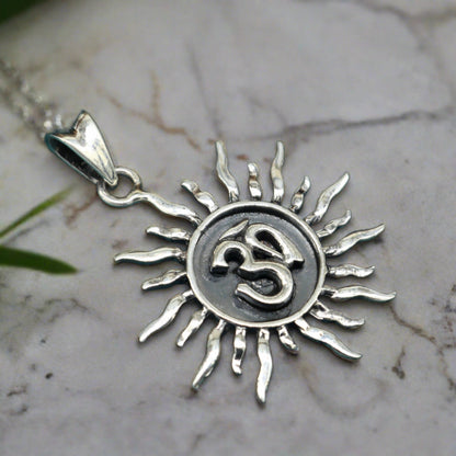 Sterling silver Aum OM pendant from TRIBAL ORNAMENTS, unisex handmade jewelry with intricate cross design, perfect for gifting.