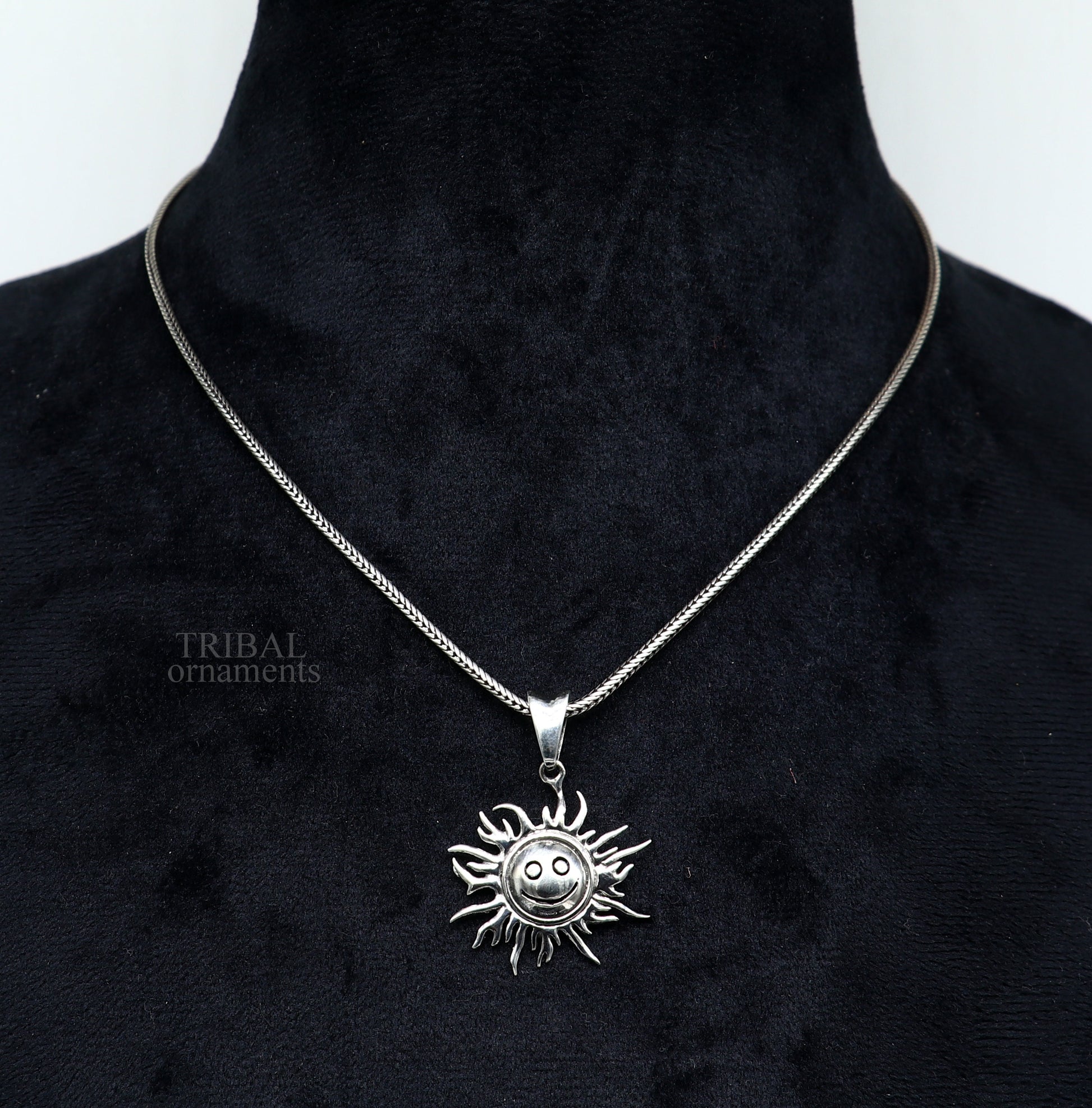Handmade 925 sterling silver sun face pendant with intricate ethnic design, showcasing divine tribal jewelry craftsmanship.