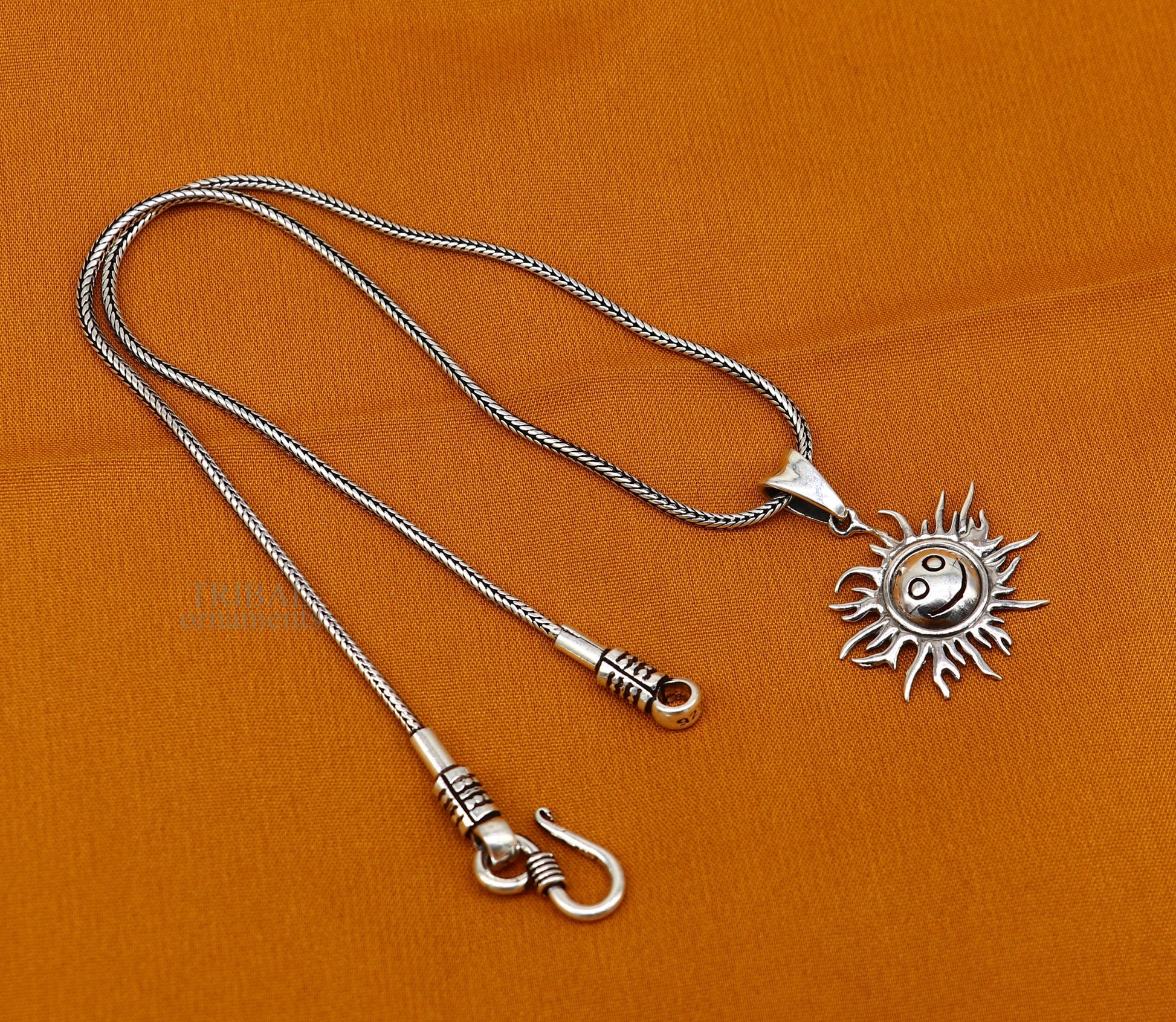 Handmade 925 sterling silver sun face pendant with ethnic design, intricate vintage jewelry by TRIBAL ORNAMENTS.