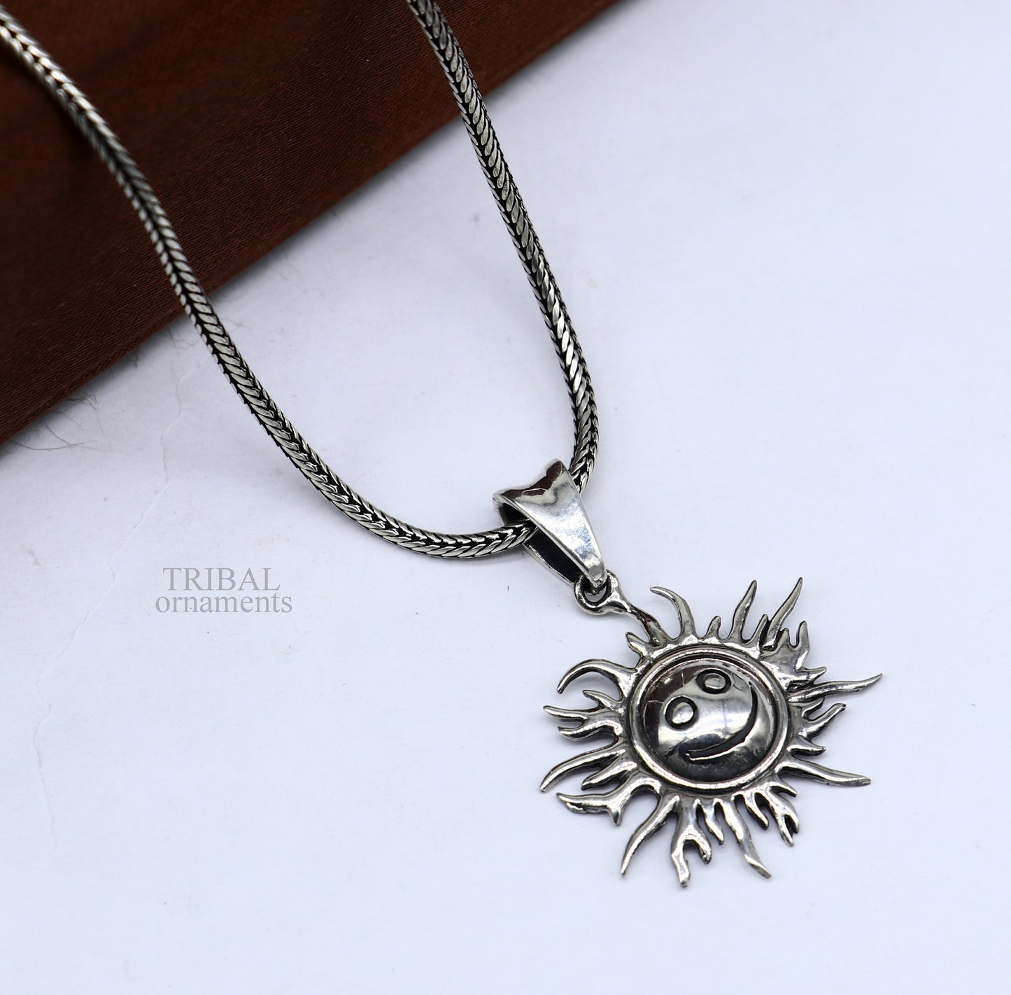 Handmade 925 sterling silver sun face pendant with vintage tribal design, showcasing ethnic divine jewelry style.