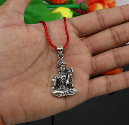 Sterling silver Lord Hanuman pendant by TRIBAL ORNAMENTS, handmade divine Hindu jewelry featuring intricate design.
