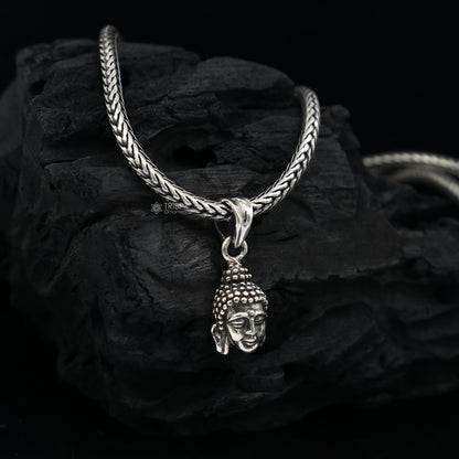 925 silver Lord Buddha face pendant by TRIBAL ORNAMENTS, close to the heart, symbolizing inner peace and wisdom.