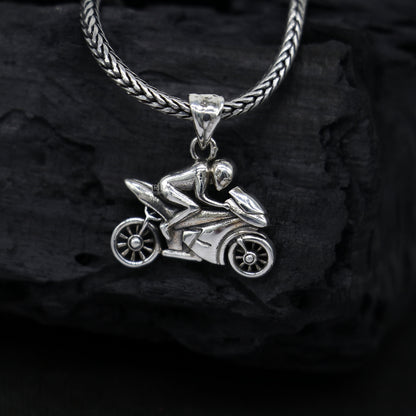 Sterling silver bike or motorcycle pendant by Tribal Ornaments, stylish unisex jewelry for bike lovers, featuring detailed silver craftsmanship.