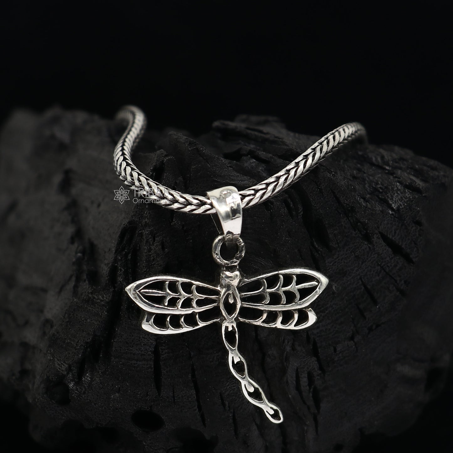 Sterling silver butterfly pendant by TRIBAL ORNAMENTS, unisex jewelry with detailed butterfly design on a silver necklace.