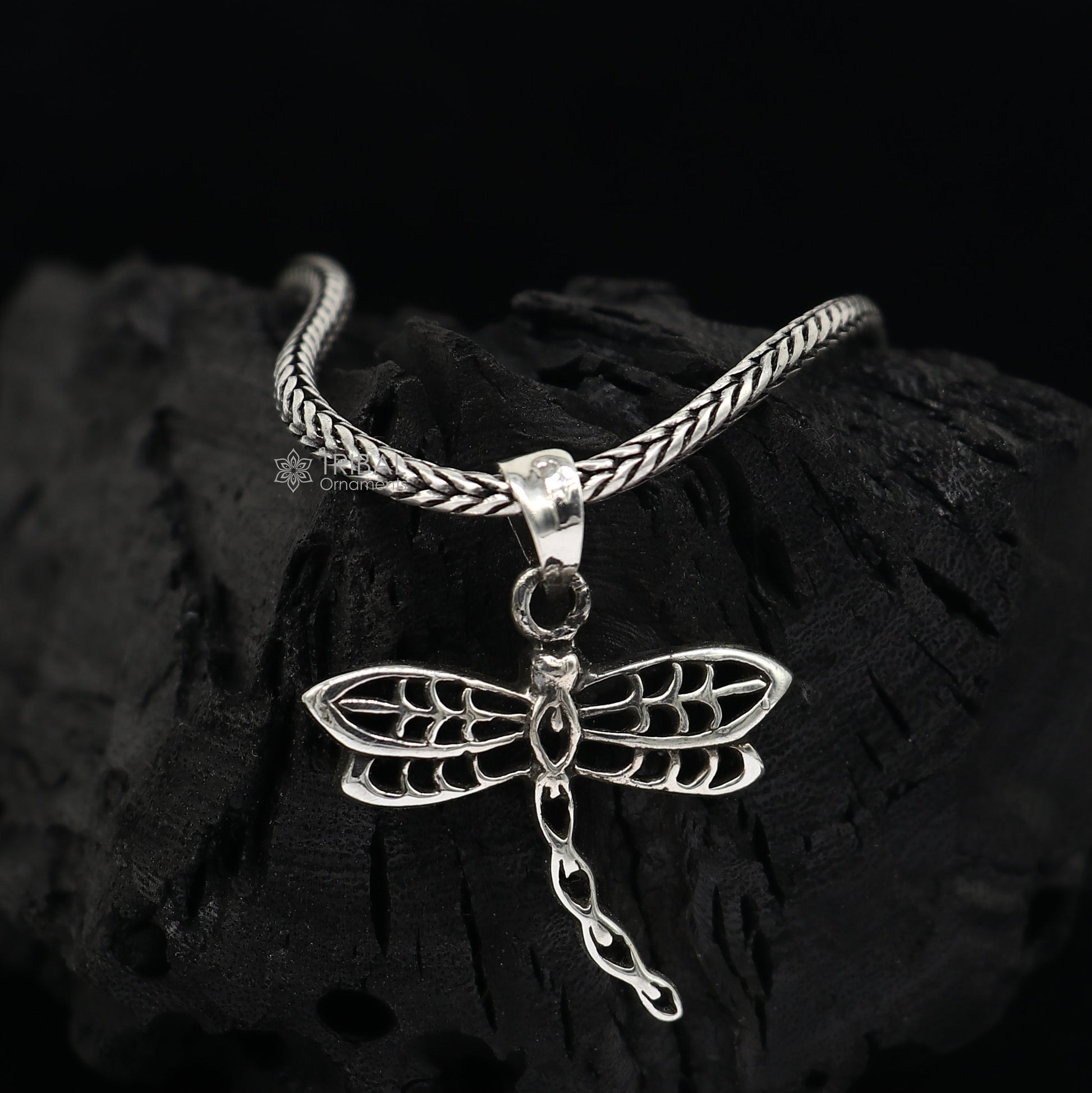 Sterling silver butterfly pendant by TRIBAL ORNAMENTS, unisex jewelry with detailed butterfly design on a silver necklace.