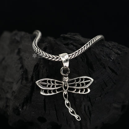Sterling silver butterfly pendant by TRIBAL ORNAMENTS, unisex jewelry with detailed butterfly design on a silver necklace.