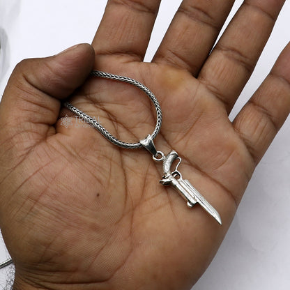 Sterling silver gun pendant by Tribal Ornaments, unisex revolver jewelry, detailed and stylish silver pistol necklace accessory.