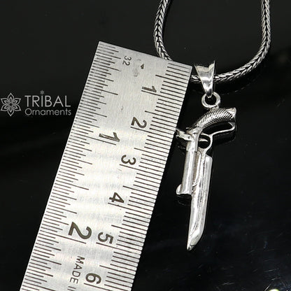 Sterling silver gun pendant by Tribal Ornaments, unisex revolver jewelry, stylish and unique silver pistol necklace accessory.