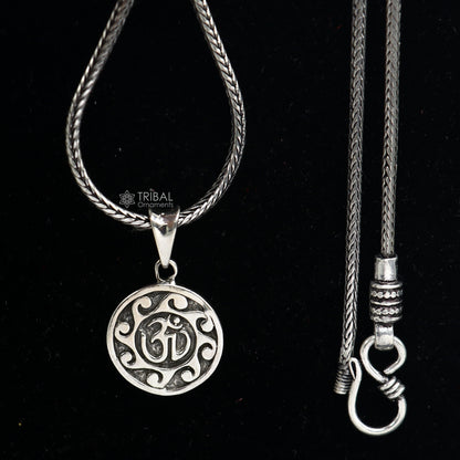 Sterling silver Divine Aum OM pendant by Tribal Ornaments, handmade tribal jewelry with good luck symbolism and intricate design.