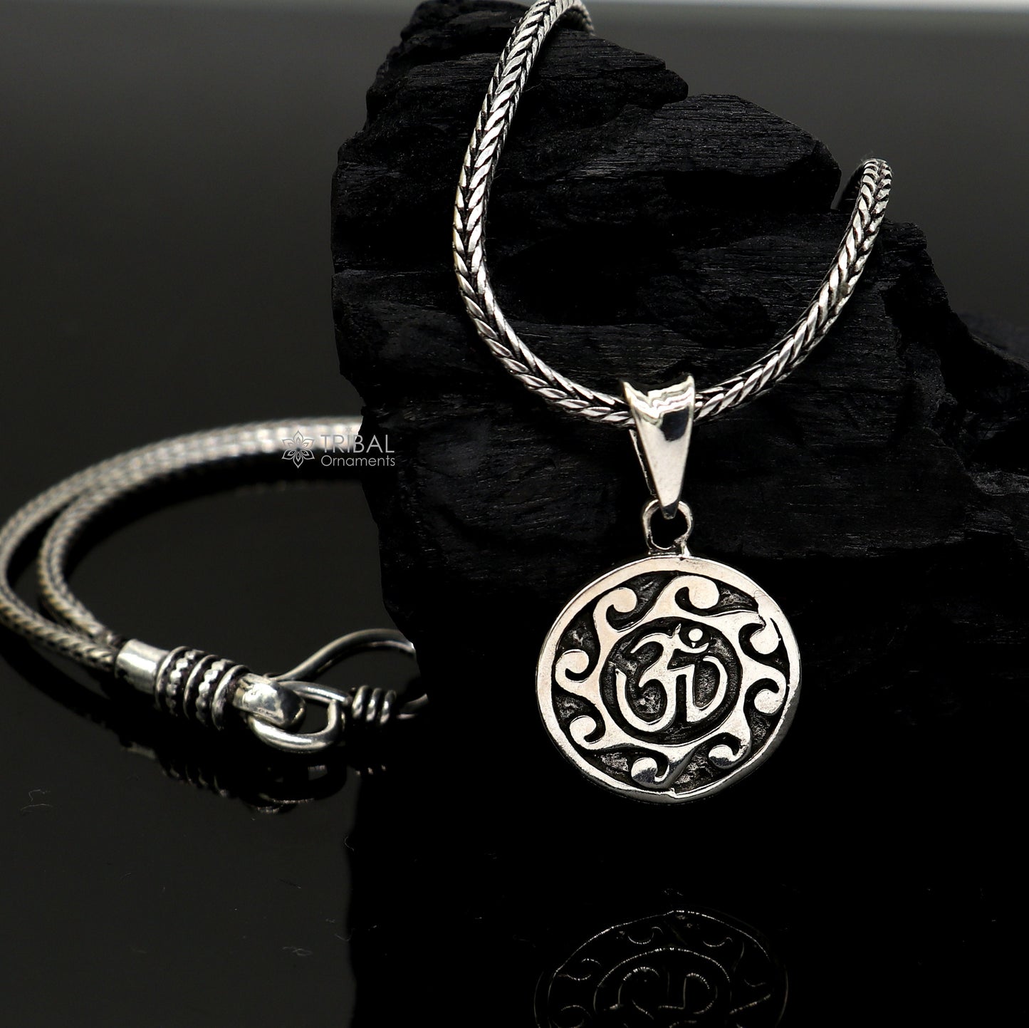Sterling silver Divine 'Aum' OM pendant by TRIBAL ORNAMENTS, handmade tribal jewelry with good luck symbol and stylish design.