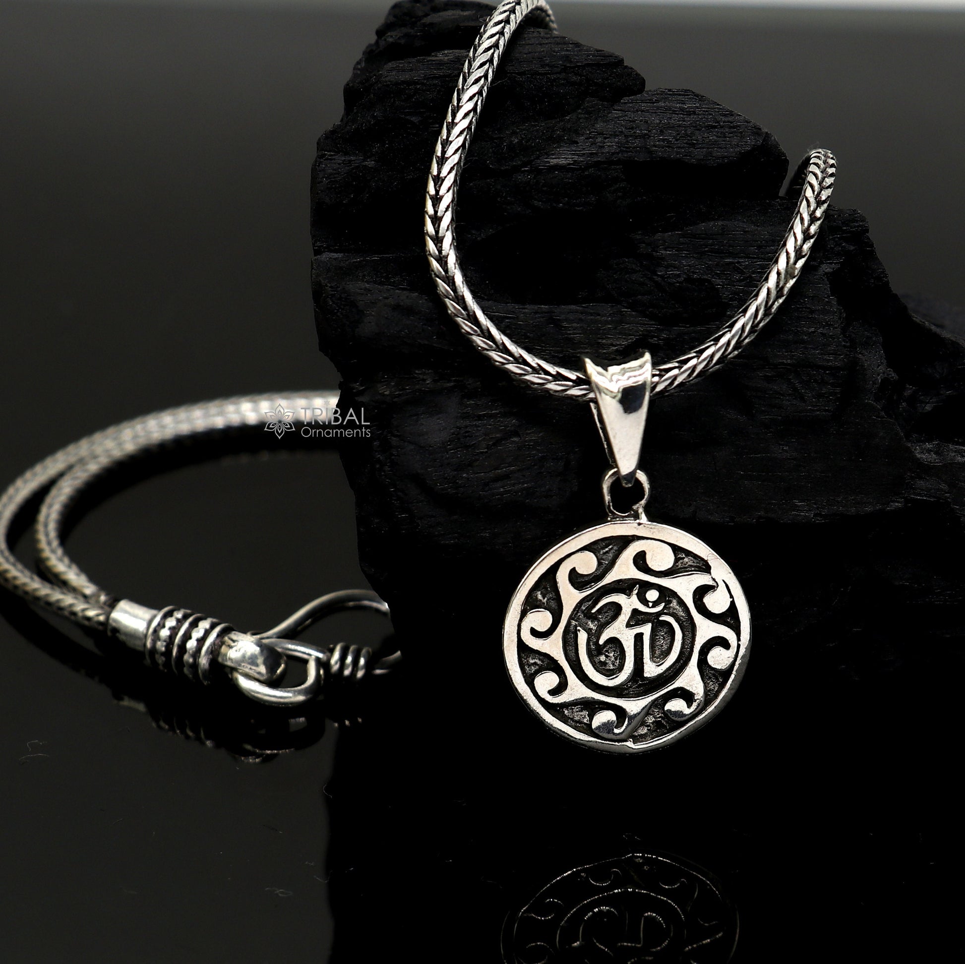 Sterling silver Divine 'Aum' OM pendant by TRIBAL ORNAMENTS, handmade tribal jewelry with good luck symbol and stylish design.