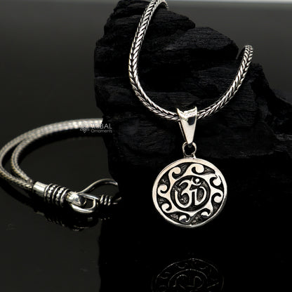 Sterling silver Divine 'Aum' OM pendant by TRIBAL ORNAMENTS, handmade tribal jewelry with good luck symbol and stylish design.