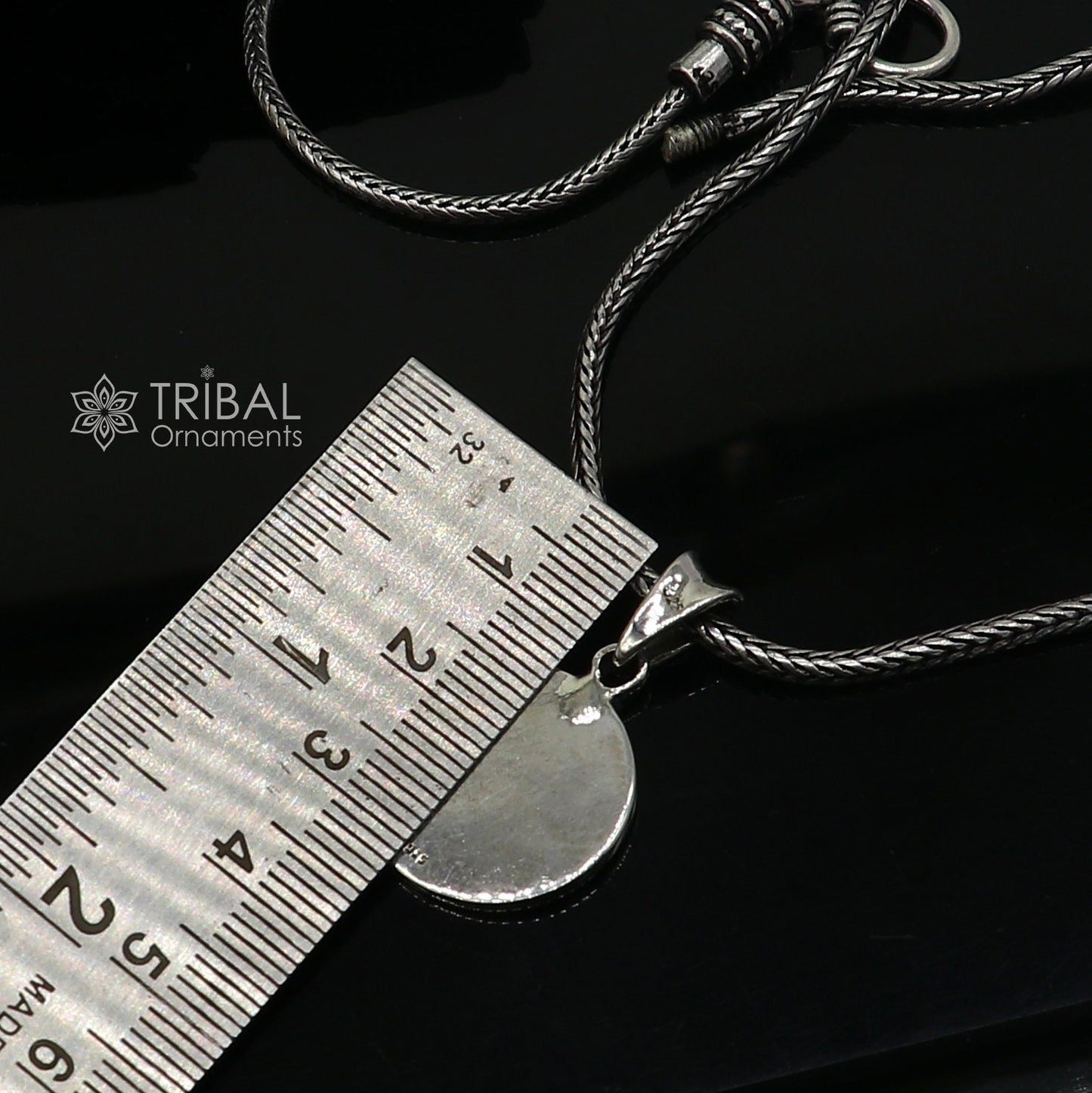 Sterling silver Divine Aum OM pendant by Tribal Ornaments, handmade tribal jewelry with good luck symbolism.