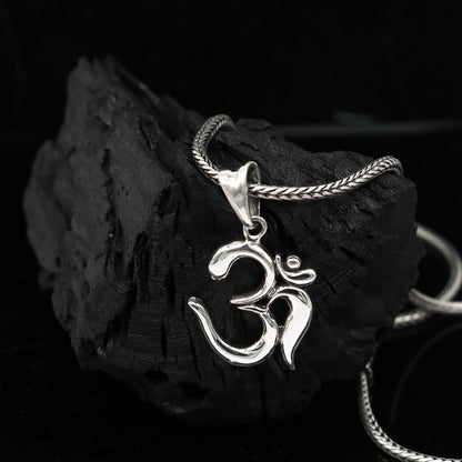 Sterling silver Divine 'Aum' OM pendant by TRIBAL ORNAMENTS, handmade tribal jewelry with good luck symbolism.