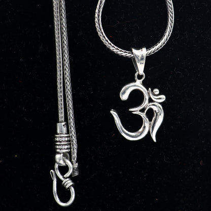 Sterling silver Divine Aum OM pendant by TRIBAL ORNAMENTS, handmade tribal jewelry featuring good luck symbolism and intricate design.