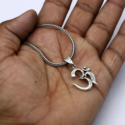 925 silver Divine 'Aum' OM pendant by TRIBAL ORNAMENTS, handcrafted tribal jewelry with intricate tribal design and spiritual symbolism