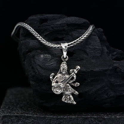 Sterling silver goddess Saraswati pendant by TRIBAL ORNAMENTS, featuring intricate handmade design for student jewelry and prayer.